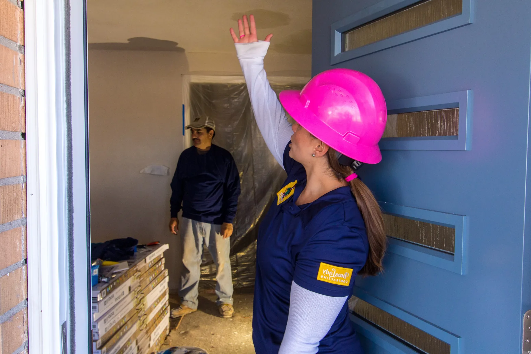 Alex Crawfurd inside an active BossLady Contracting renovation